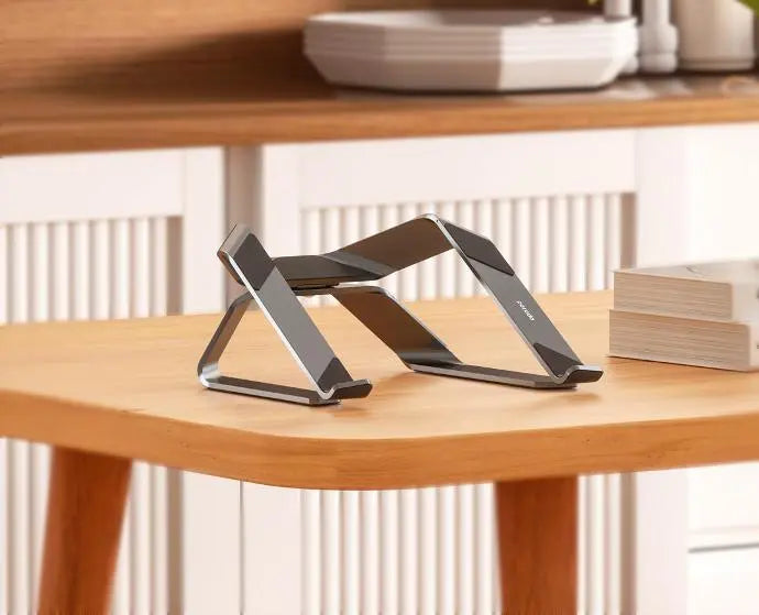 A Photo Of Porodo Alum. alloy 360% Rotatable and Adjustable Laptop Stand - Grey | PD-A150RALS-GY