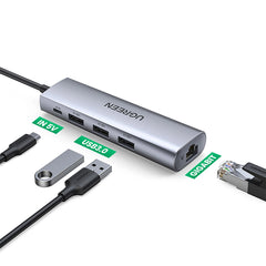 A Photo Of Ugreen CM266 60812 5-in-1 USB-A 3.0 Adapter with RJ45 Ethernet, 3x USB-A 3.0 Ports, and Micro USB